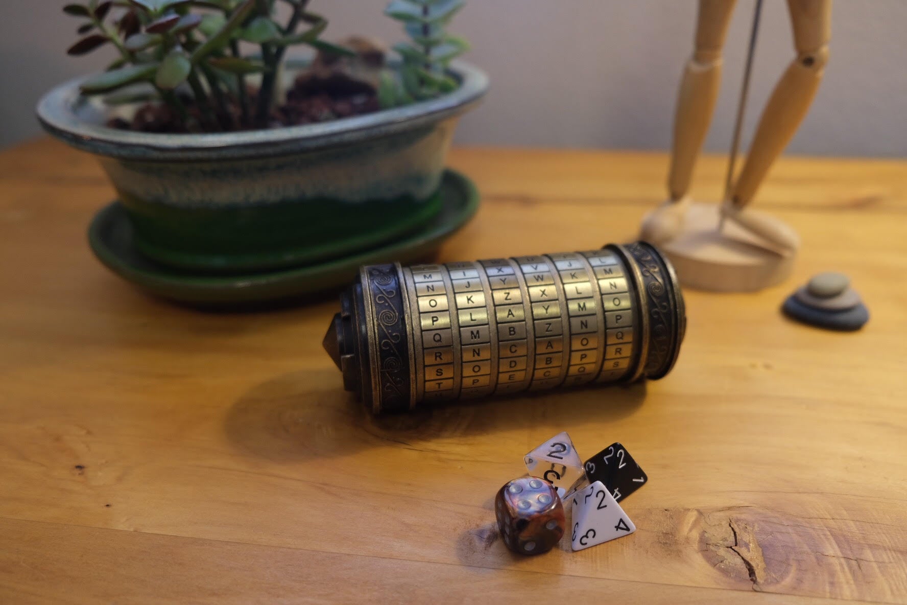 The four Playheart dice on a wooden table